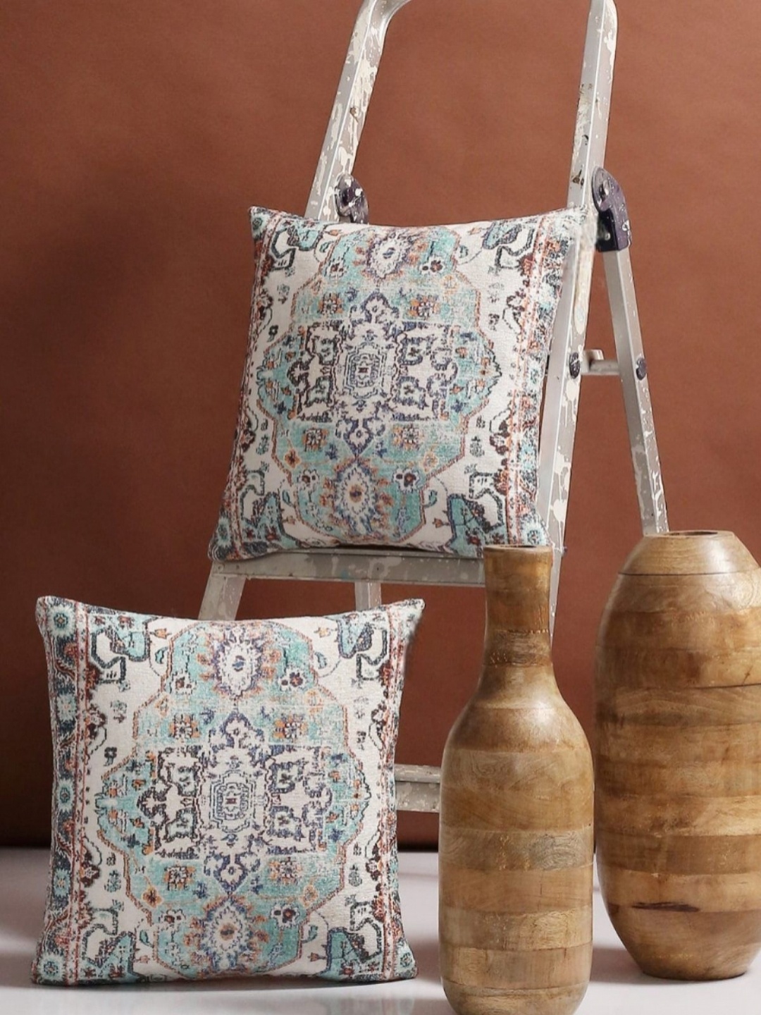

Myntra Elegant Homes White & Blue 2 Pieces Ethnic Motifs Square Cushion Covers