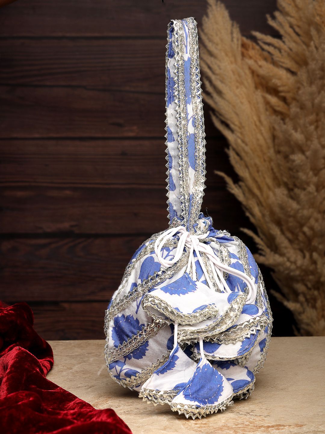

Dhrohar Embellished Potli Clutch, Blue