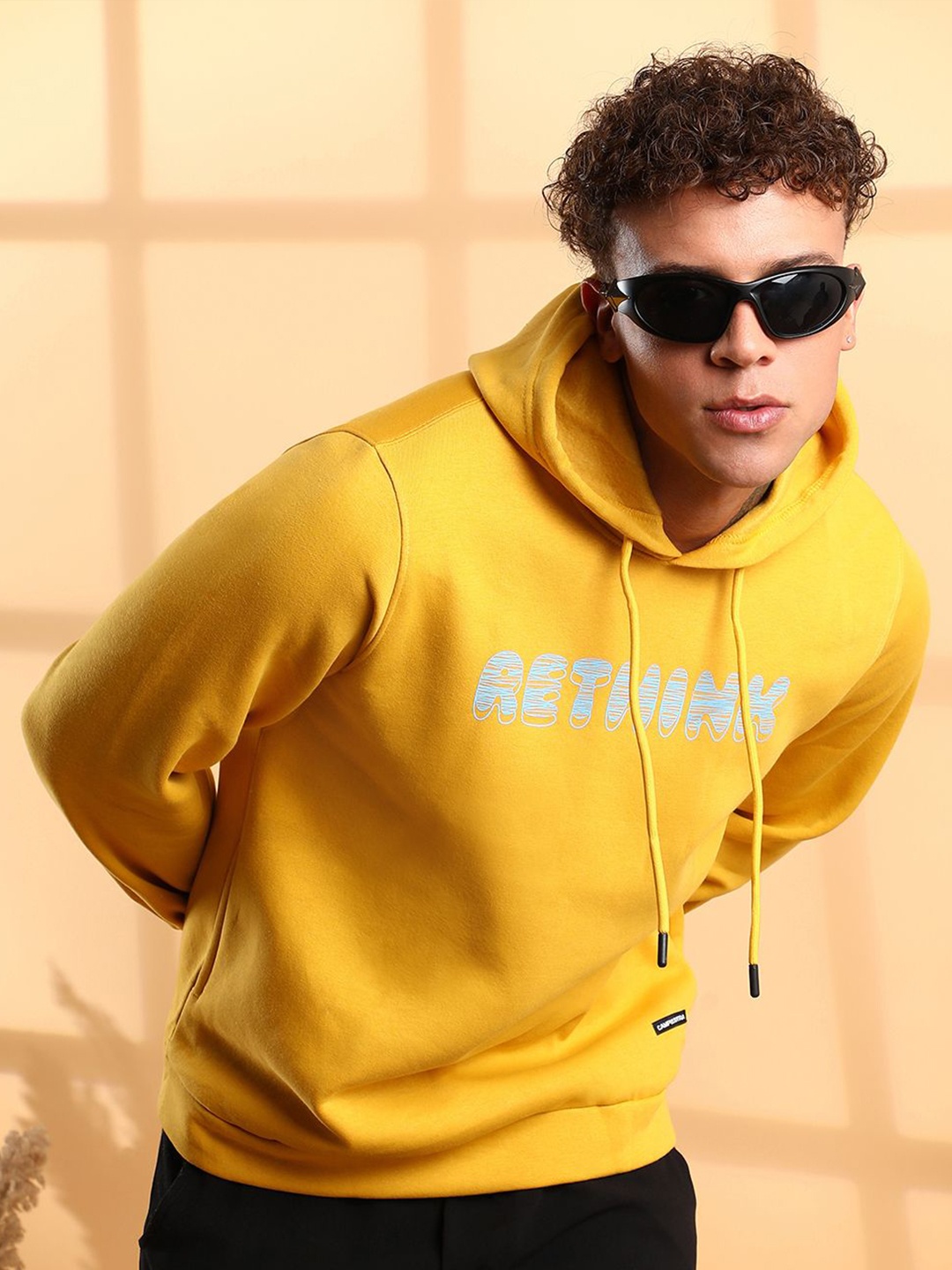 

Campus Sutra Men Printed Hooded Sweatshirt, Yellow