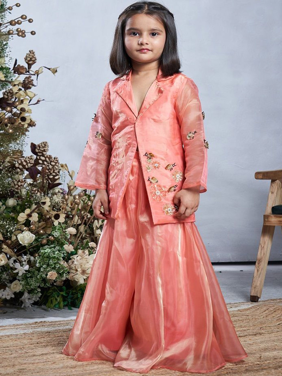 

Vivedkids Girls Floral Embroidered Lapelled Collar Beads and Stones Kurti With Sharara, Peach