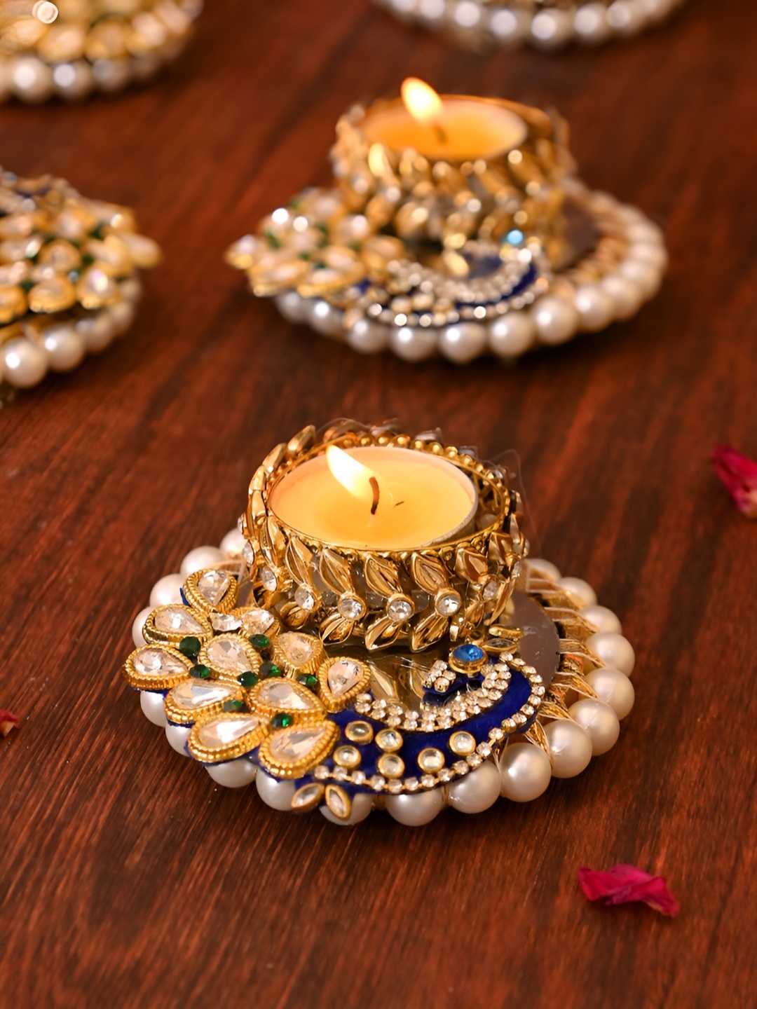 

Aapno Rajasthan Gold-Toned 2 Pieces Peacock Pattern Tea Light Candle Holder