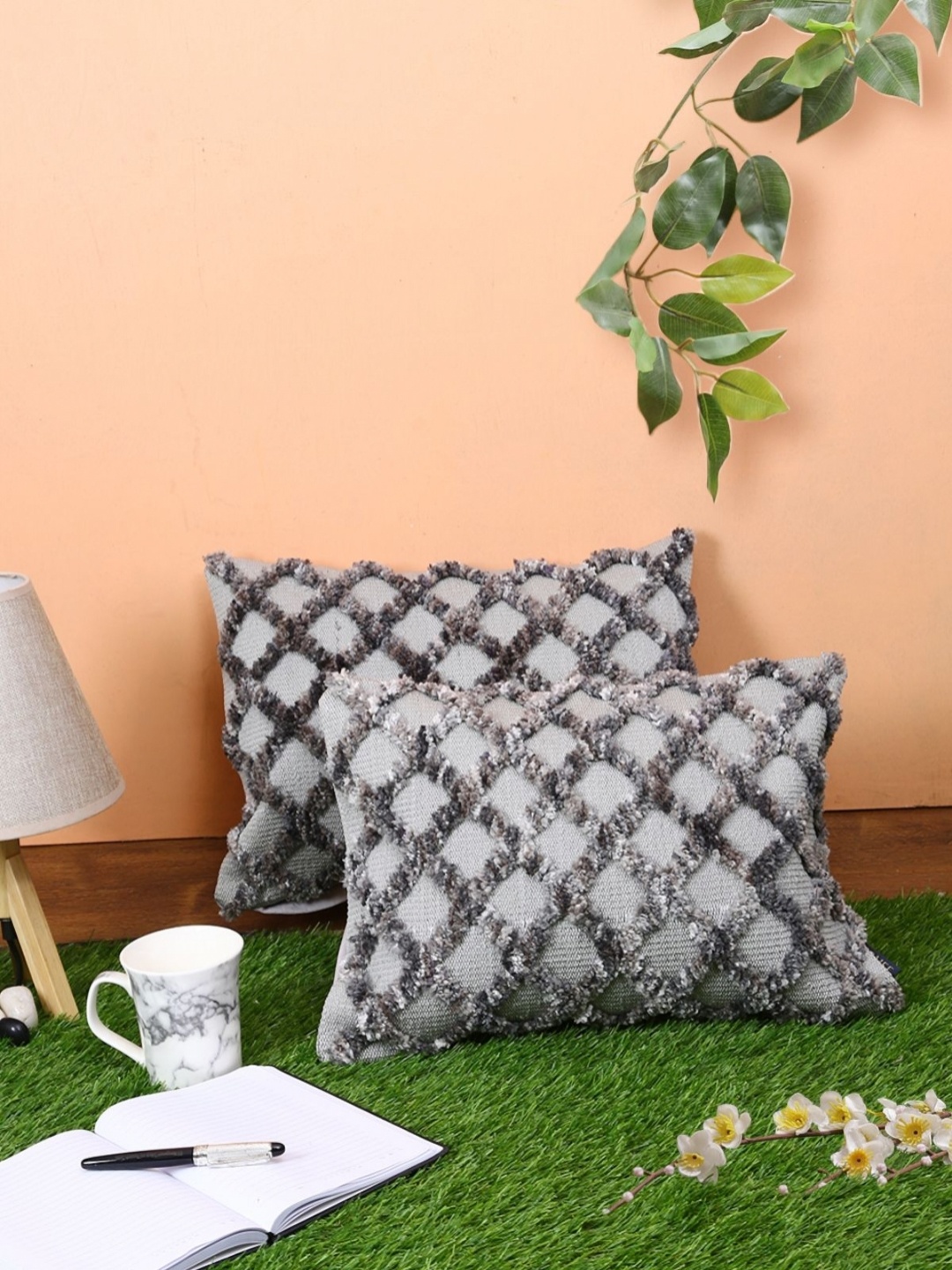 

Myntra Elegant Homes Grey 2 Pieces Geometric Woollen Rectangle Cushion Covers