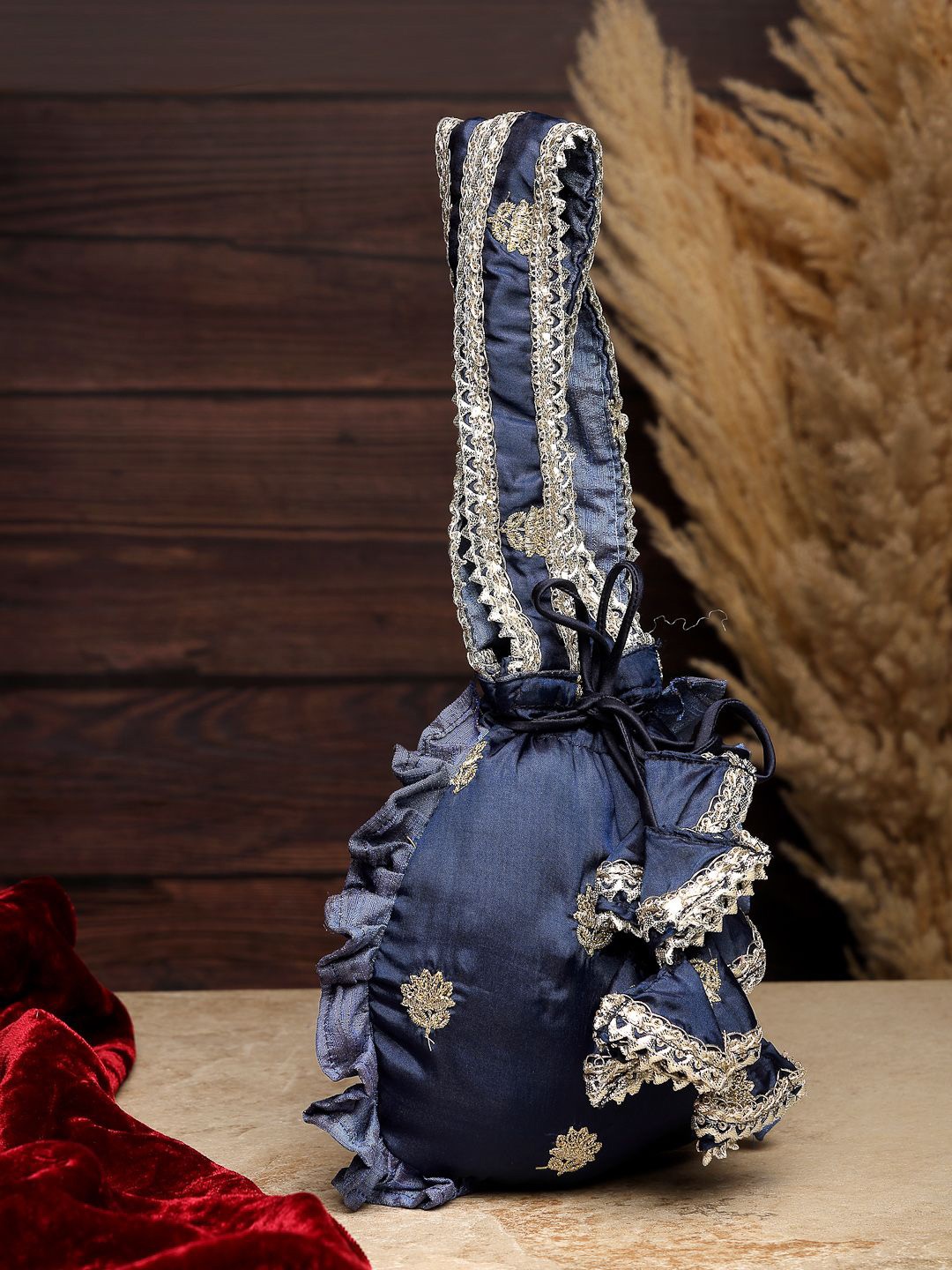 

Dhrohar Embellished Potli Clutch, Navy blue