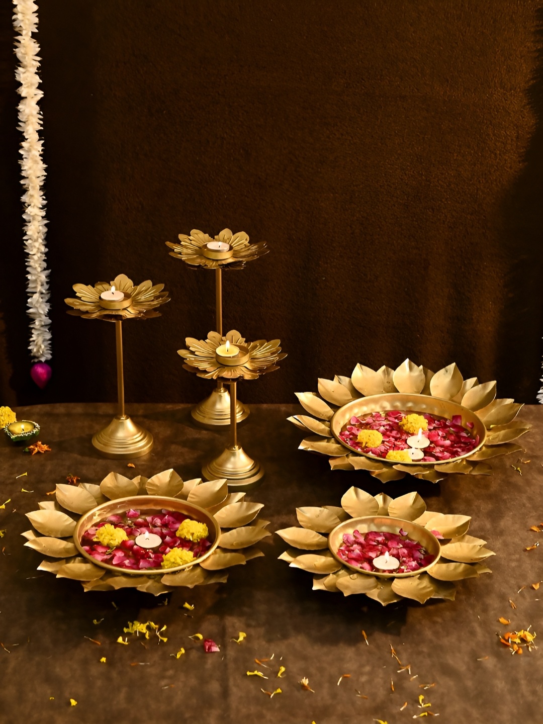 

Aapno Rajasthan Gold Toned 6 Pieces Metal Lotus Urli with Candle Stands