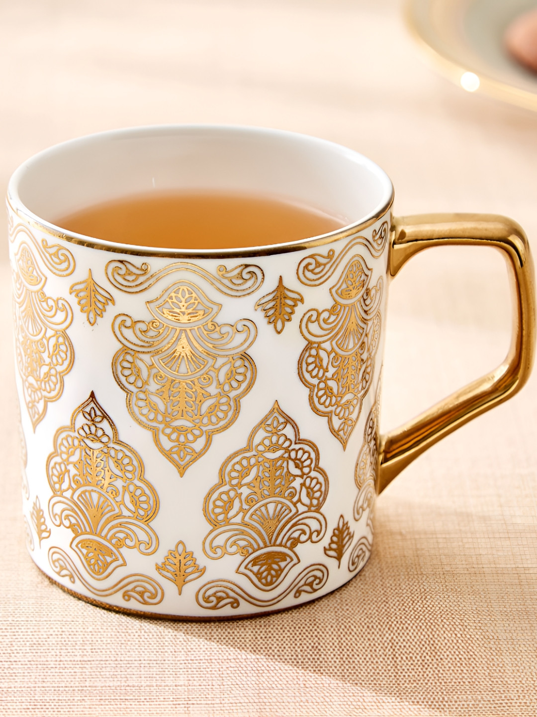 

Home Centre Gold-Toned & White Printed Bone China Glossy Mugs Set of Cups and Mugs