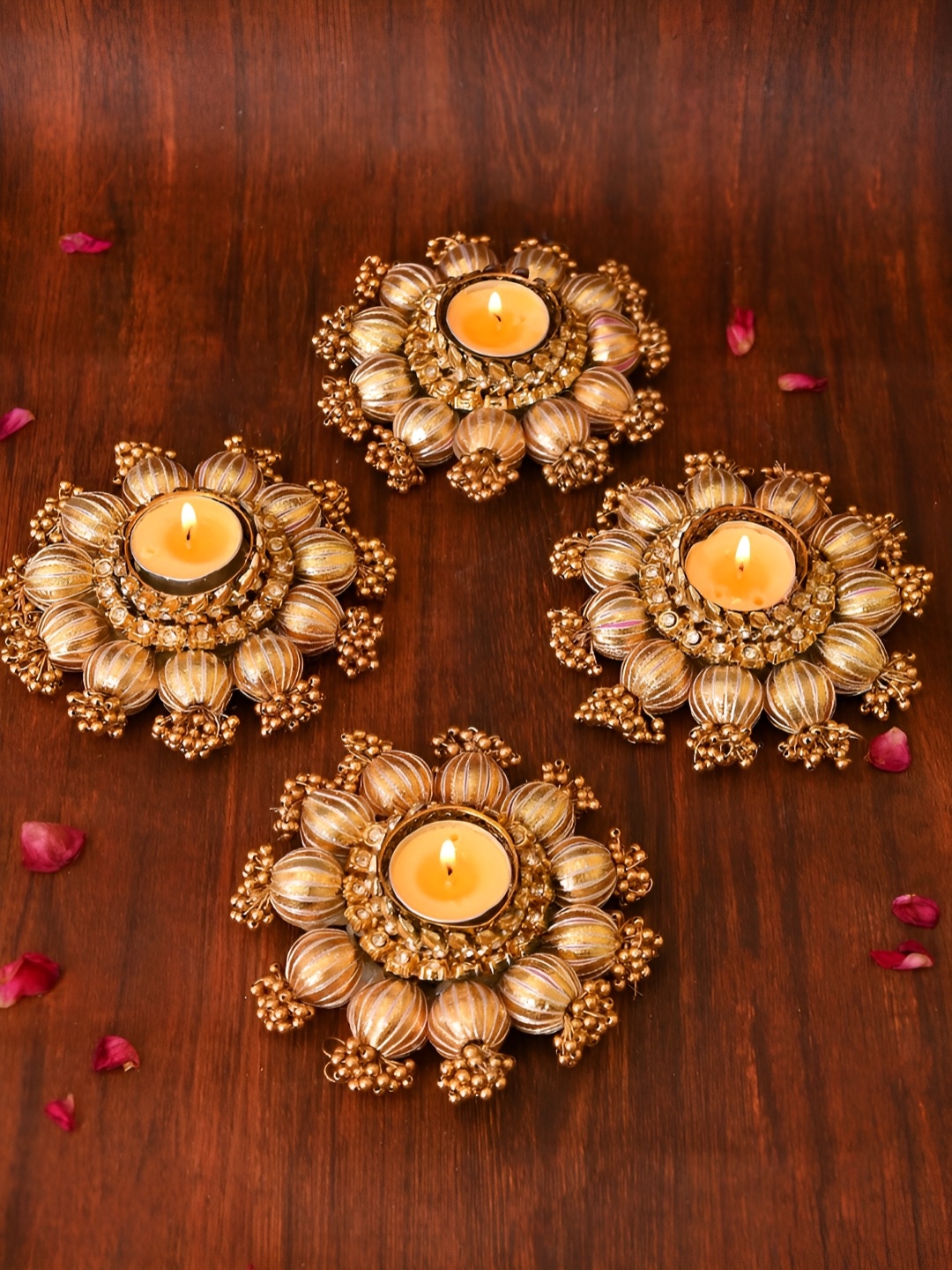 

Aapno Rajasthan Gold Toned 4 Pieces Embellished Metal Diyas With Tea Light Candles