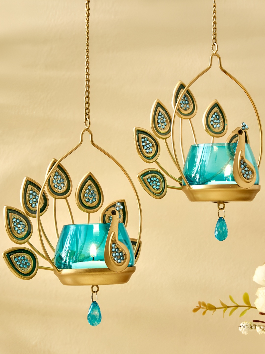 

Home Centre Blue & Gold Toned 2 Pieces Metal Peacock Shaped Candle Holders