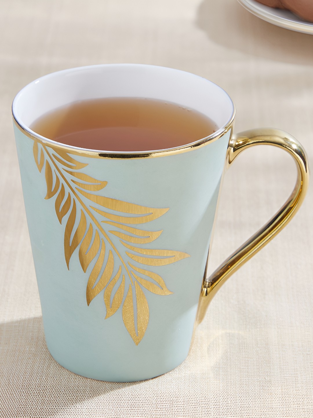 

Home Centre Green & Gold-Toned Floral Printed Bone China Glossy Mugs Set of Cups and Mugs