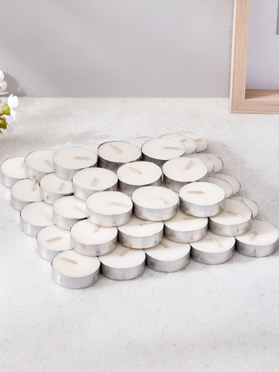 

Home Centre Luminescent White & Silver Toned 50 Pieces Tea Light Candle