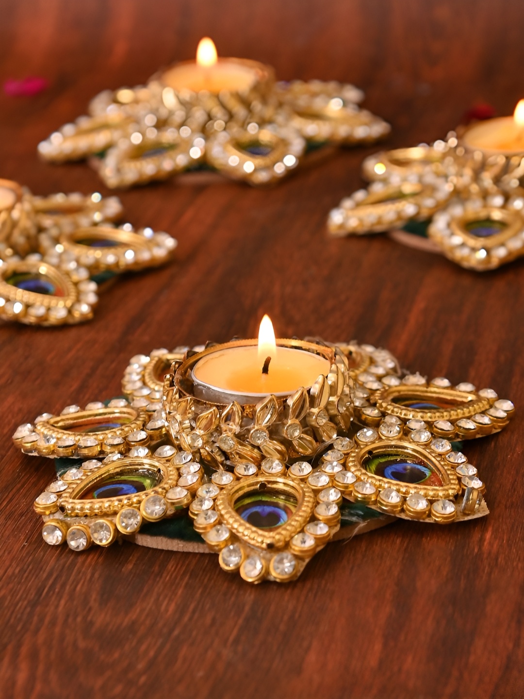 

Aapno Rajasthan Gold Toned 2 Pieces Peacock Embellished Metal Diyas With Tea Light Candles
