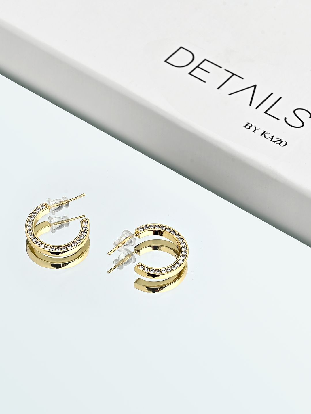 

Kazo Gold Plated American Diamond Contemporary Studs Earrings