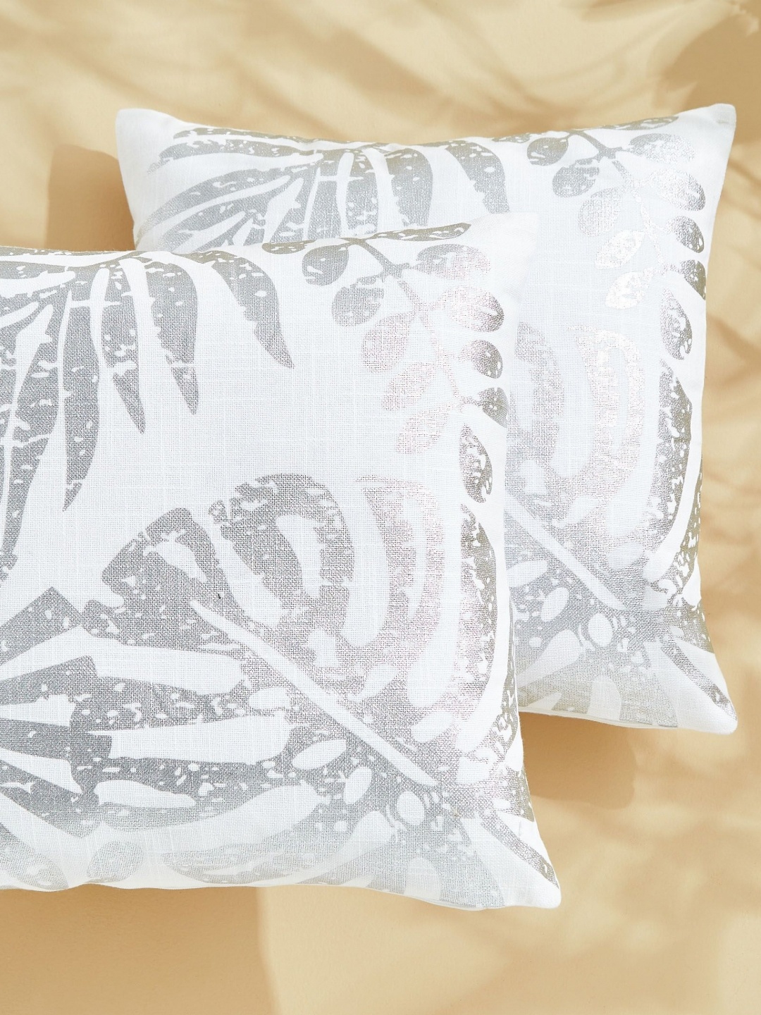 

Home Centre White & Silver-Toned Set of 2 Floral Square Cushion Covers