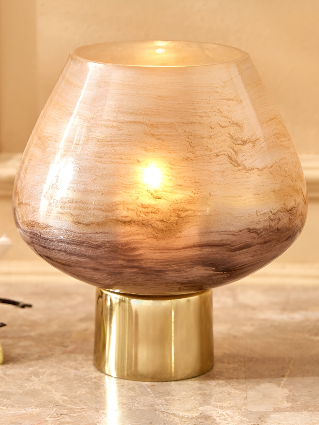 

Home Centre Eternity Viva Gold Toned & Beige Glass Candle Holder