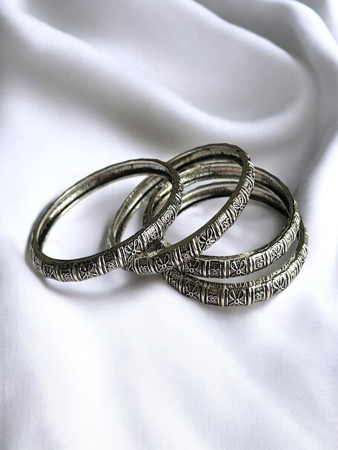 

AccessHer Set Of 4 Sterling Silver Plated Oxidized Texture Ethnic Bangles