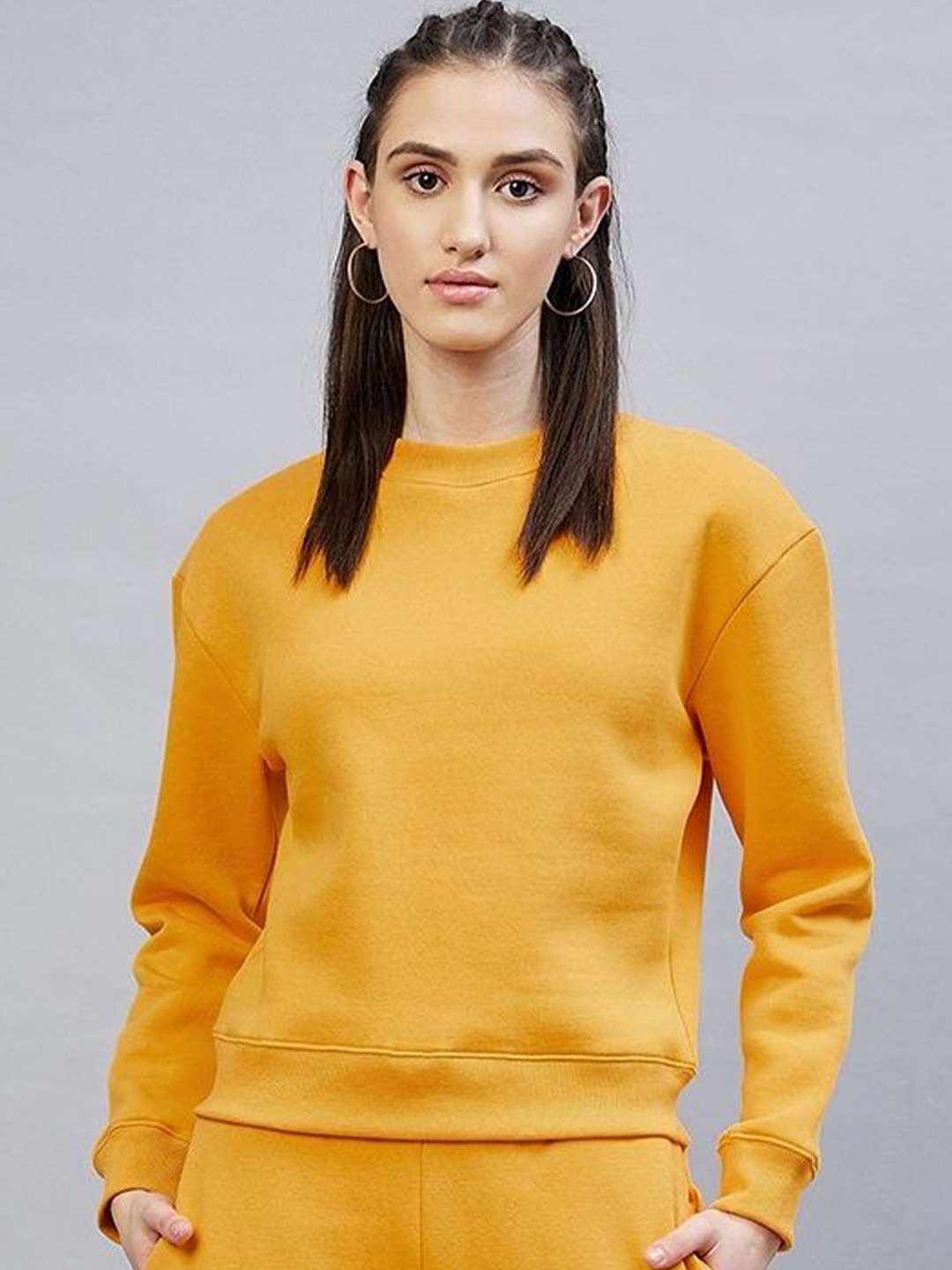 

DELAN Women Solid Round Neck Sweatshirt, Yellow