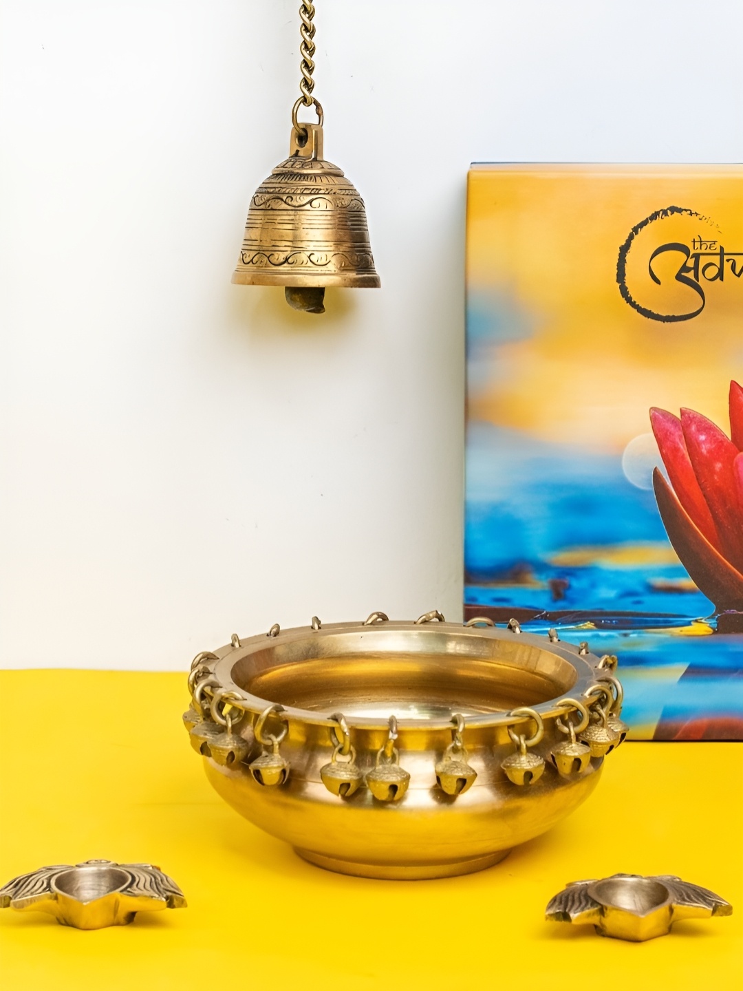 

The Advitya Brass Ghungroo Urli with Hanging Bell & Lotus Diya Pair Gift Set, Gold