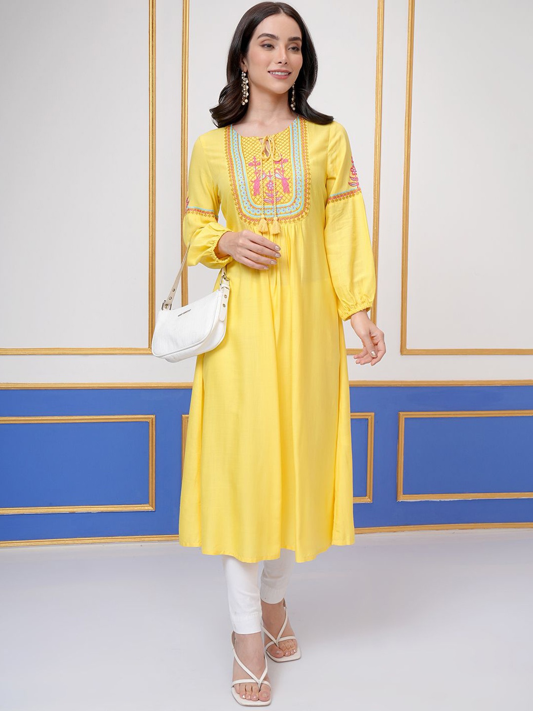

Vishudh Yellow Floral Embroidered Tie-Up Neck Long Sleeves Thread Work A-Line Kurta