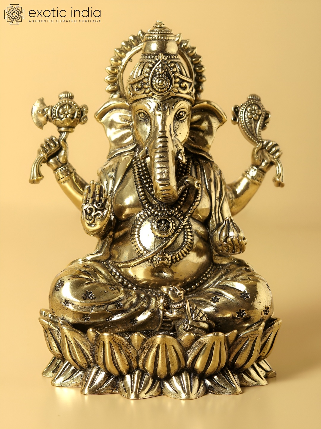 

Exotic India Gold-Toned Chaturbhuja Lord Ganesha Idol Seated Religious Figurine Showpiece