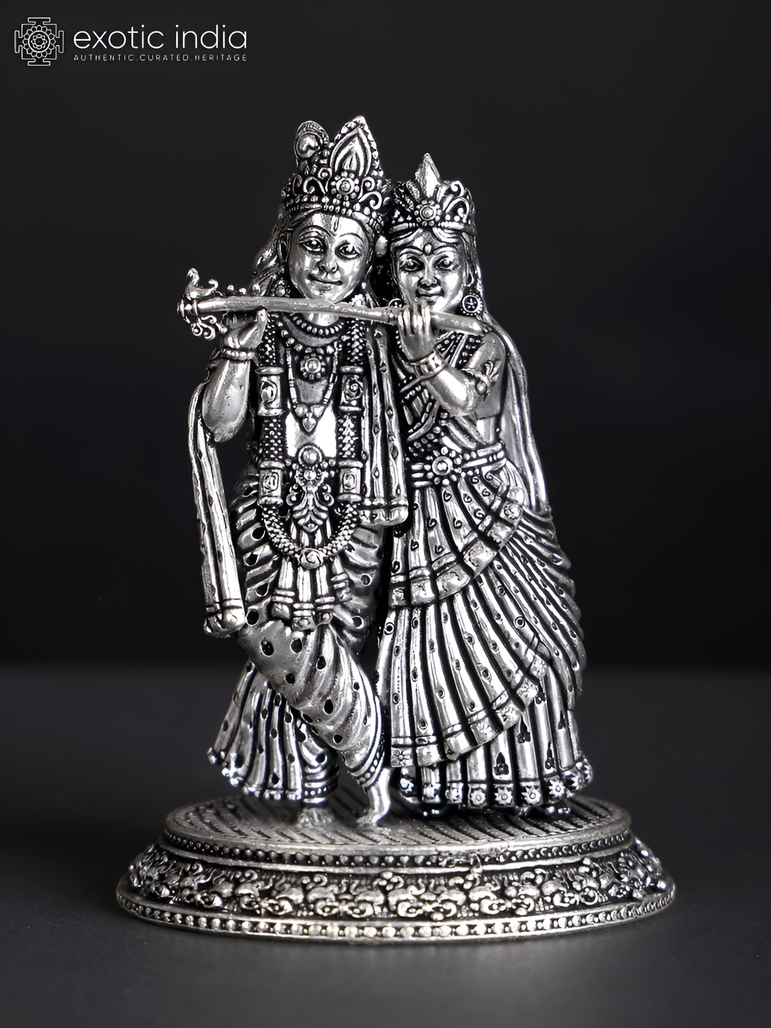 

Exotic India Silver-Toned Standing Radha Krishna Playing Flute Religious Showpiece