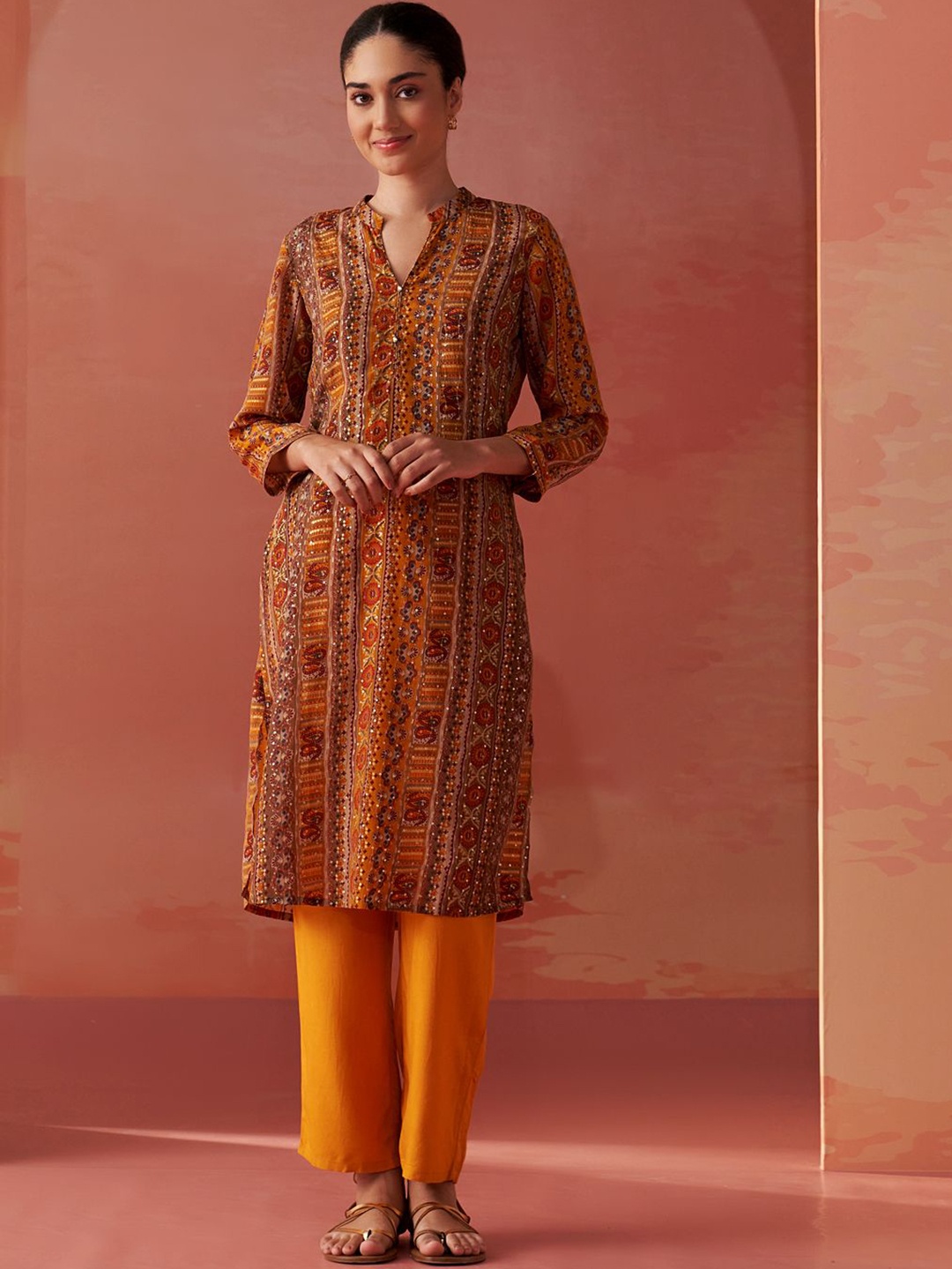 

Lakshita Ethnic Motifs Printed Sequinned Mandarin Collar Straight Kurta With Trousers, Mustard