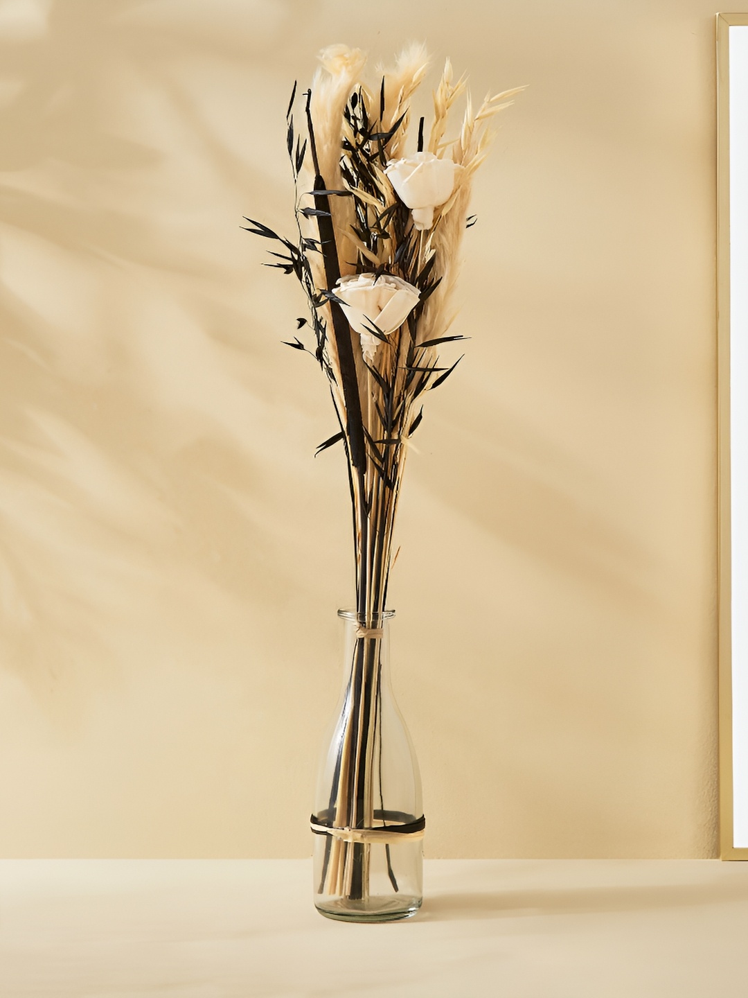 

Home Centre Transparent & Brown Artificial Flower With Pot