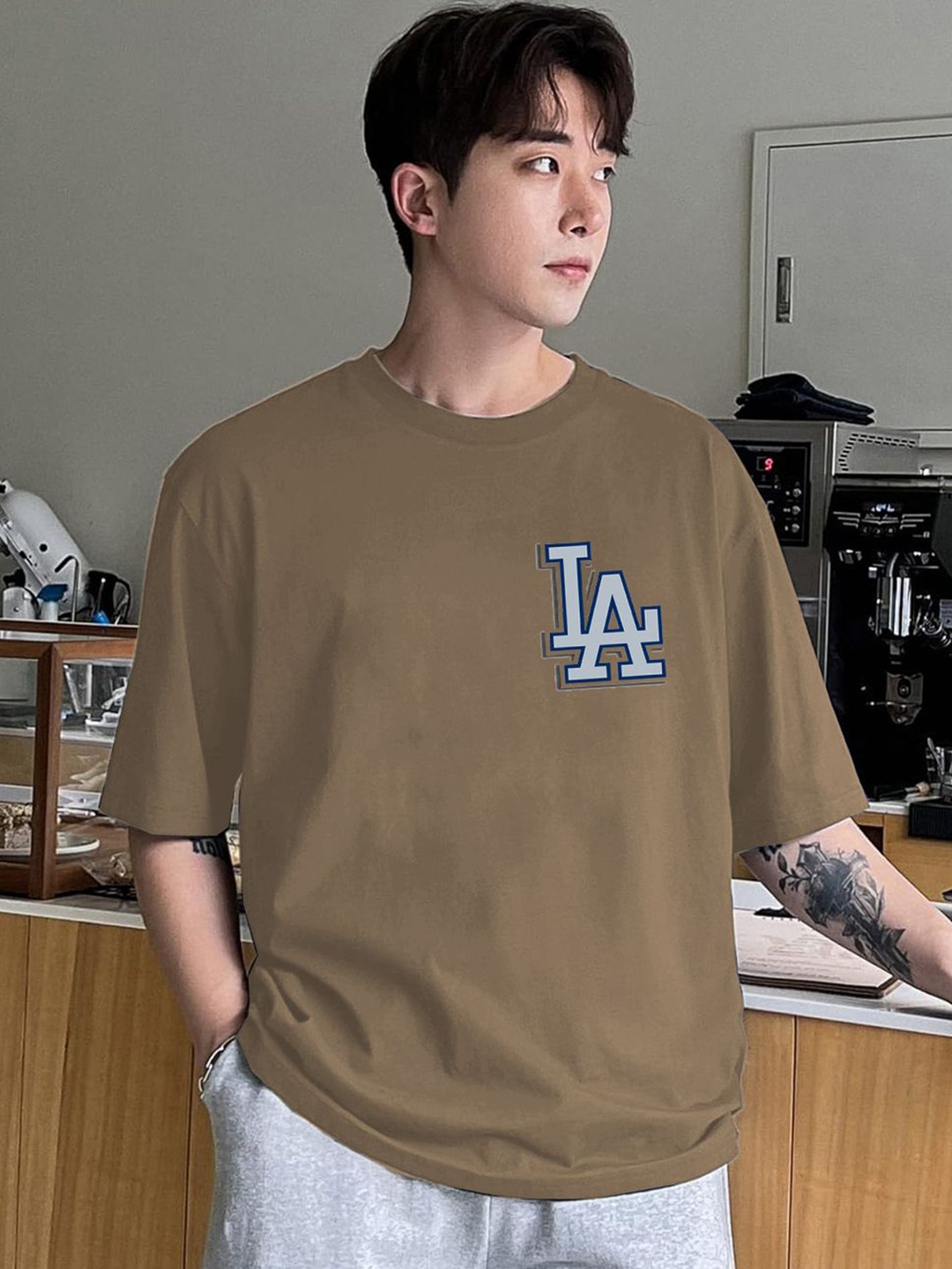 

Genzy Men Typography Printed Drop-Shoulder Sleeves Cotton T-shirt, Beige