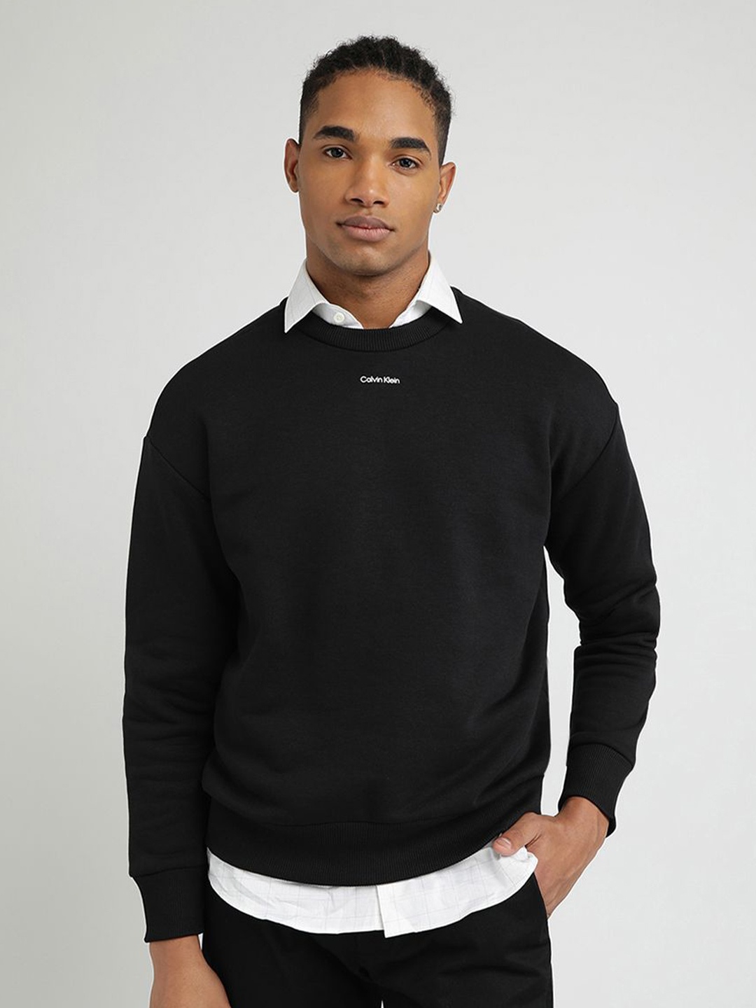 

Calvin Klein Jeans Men Solid Round Neck Cotton Pullover Sweatshirt, Black