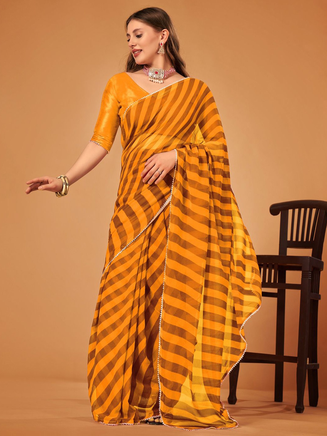 

SM TRENDZ Striped Pure Georgette Saree, Mustard