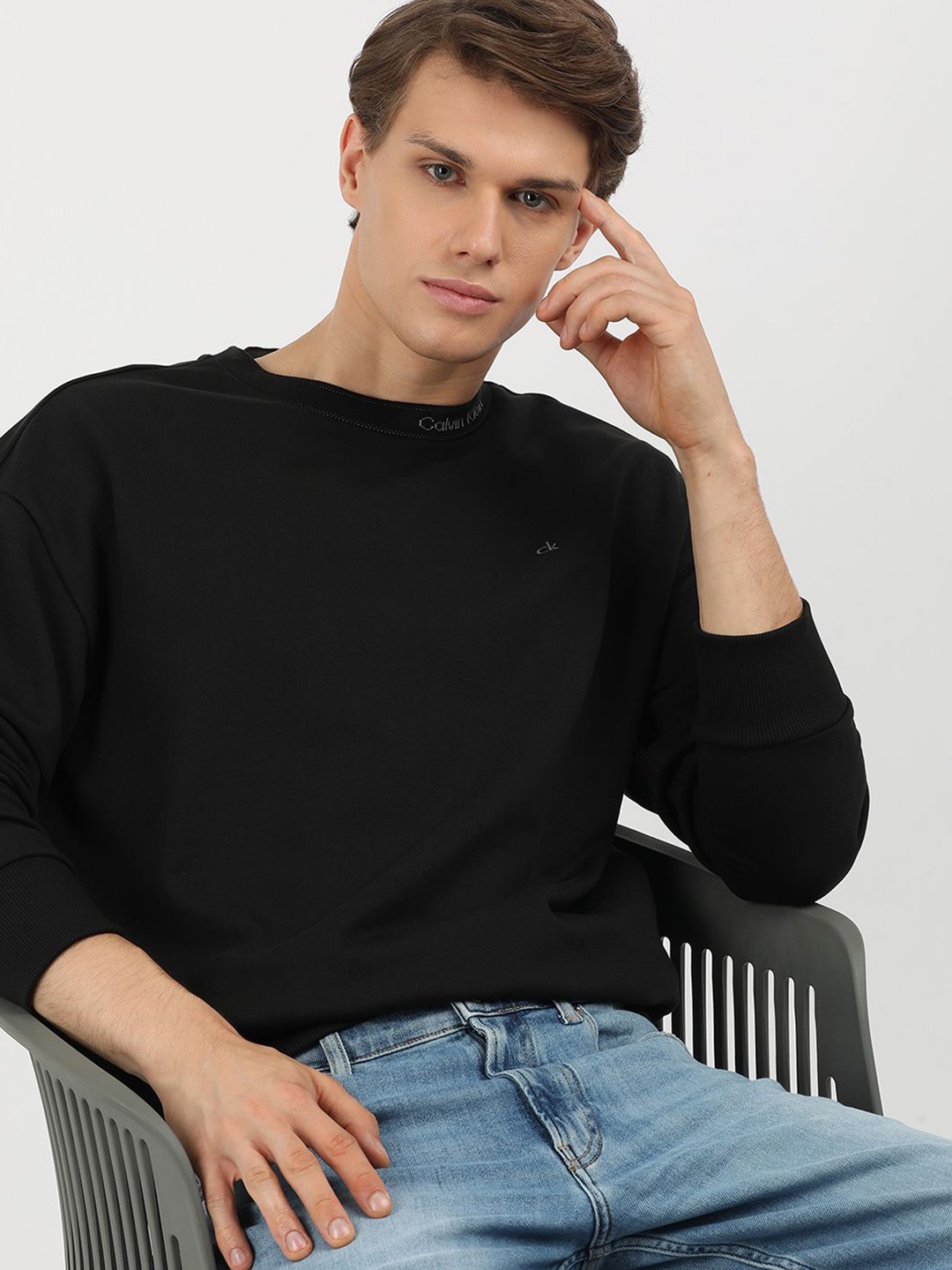 

Calvin Klein Jeans Men Solid Round Neck Cotton Pullover Sweatshirt, Black