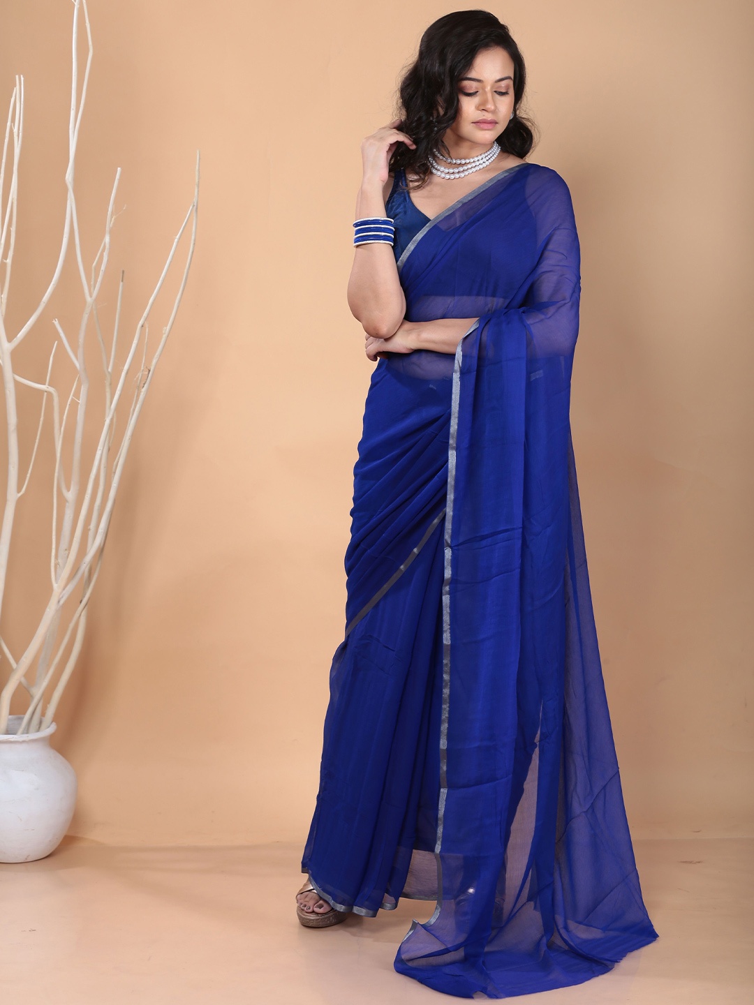 

Urbane Essence Solid Zari Pure Chiffon Saree, Blue