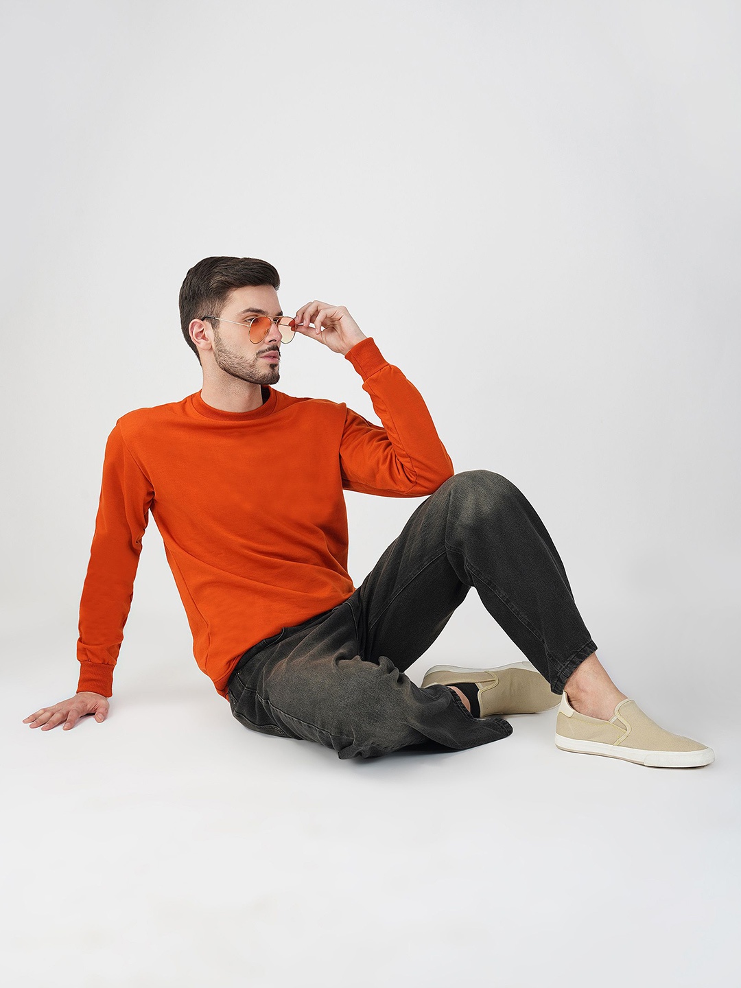 

The Roadster Lifestyle Co. Men Solid Round Neck Cotton Pullover Sweatshirt, Orange
