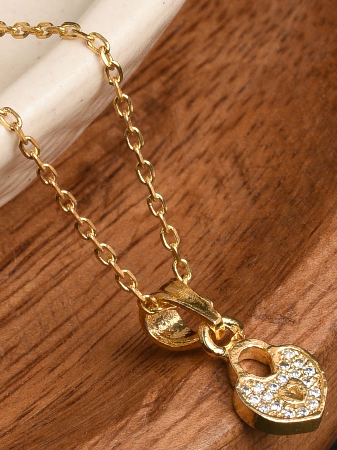 

XPNSV Gold Plated Cubic Zirconia Studded Pendant with Chain