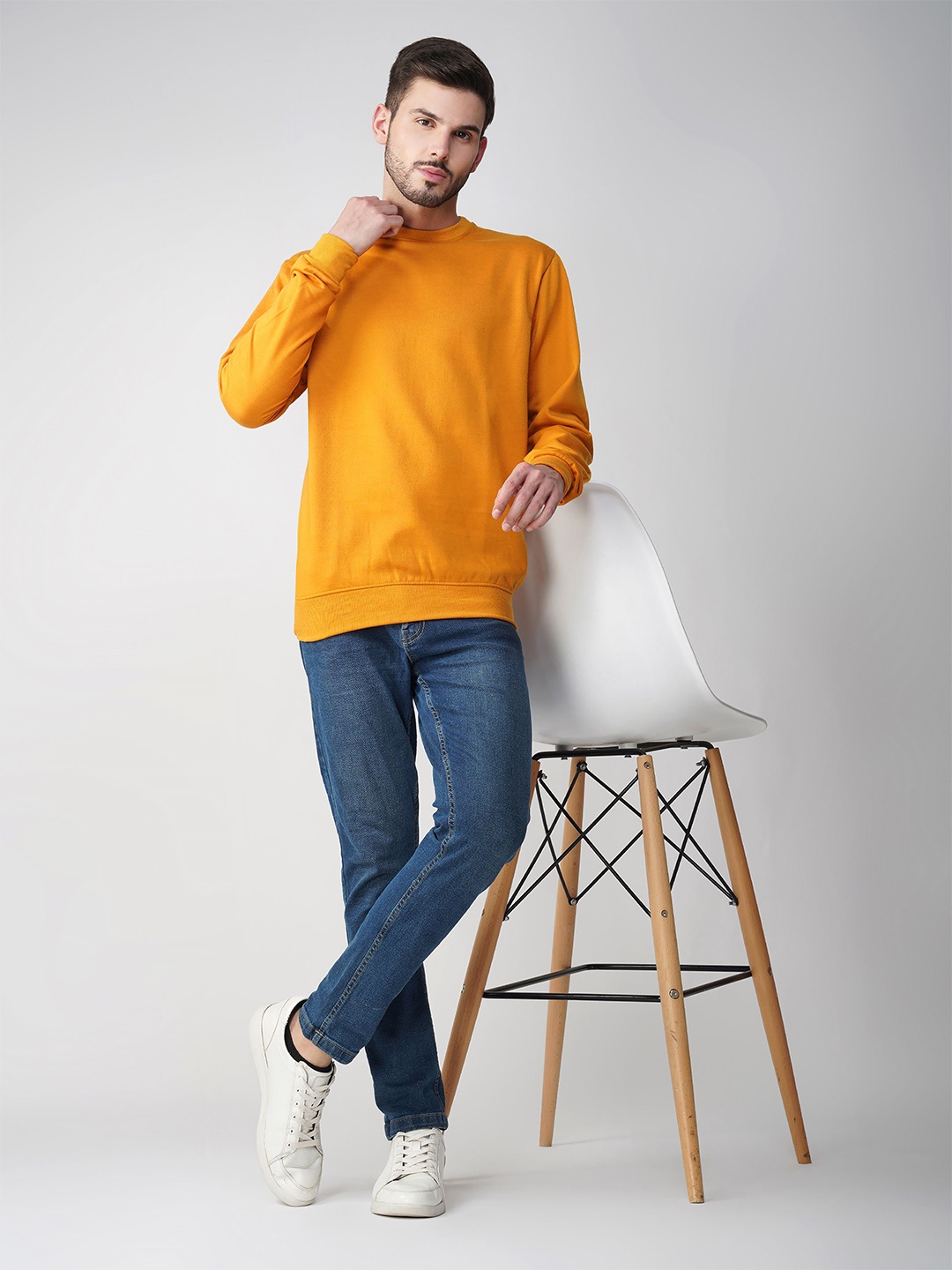 

The Roadster Lifestyle Co. Men Solid Round Neck Cotton Pullover Sweatshirt, Mustard