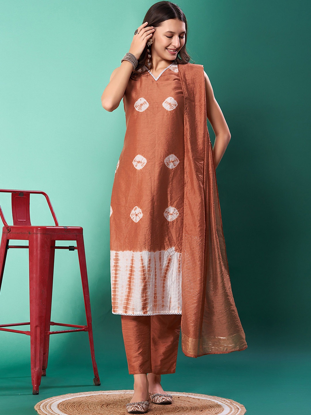 

KALINI Bandhani Dyed V-Neck Sleeveless Pure Silk Straight Kurta With Trouser & Dupatta, Brown