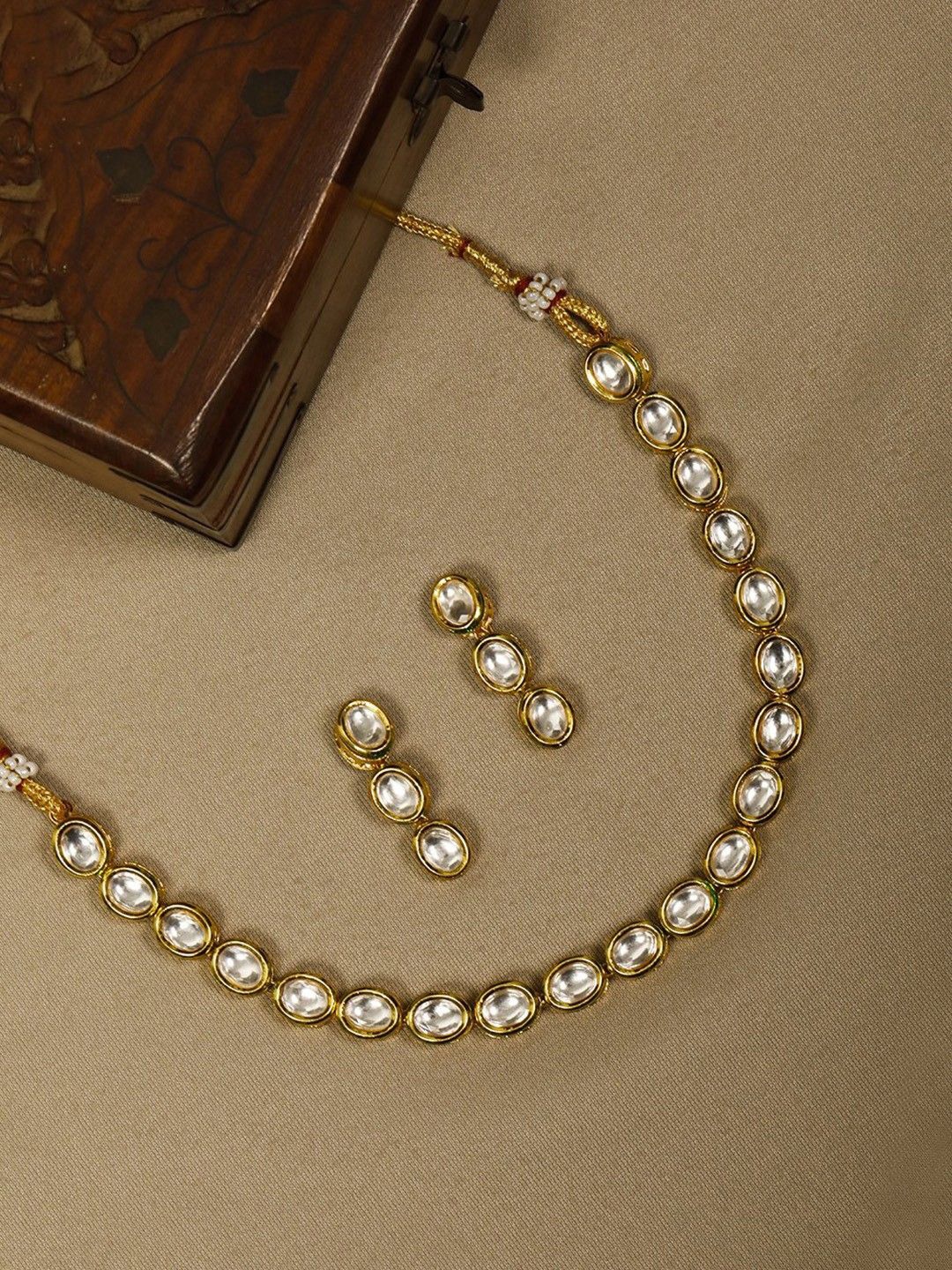 

Priyaasi Gold Plated Kundan Stones Studded Jewellery Set