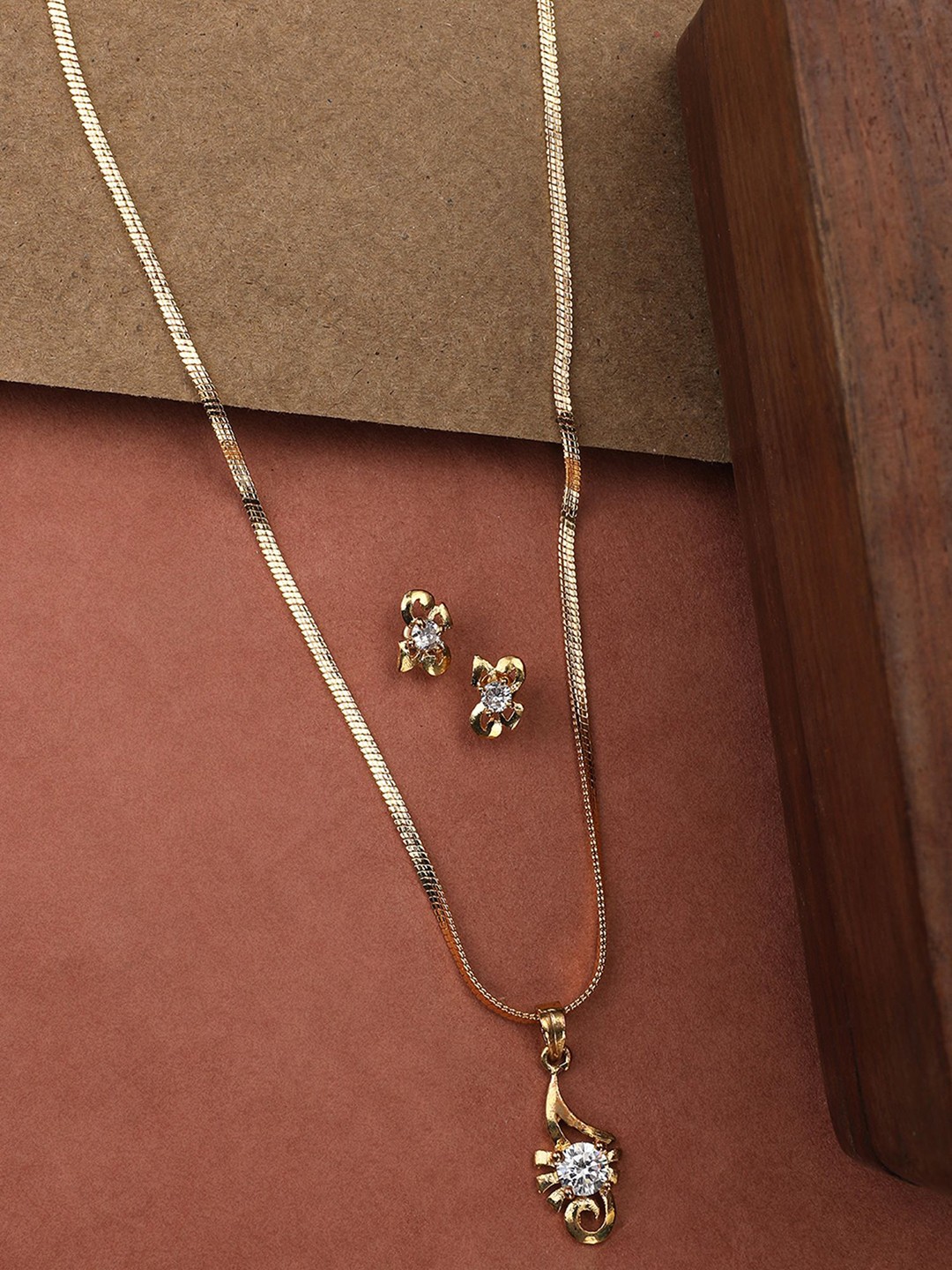 

ANIKAS CREATION Gold-Plated CZ Stone-Studded Pendant With Chain & Earrings