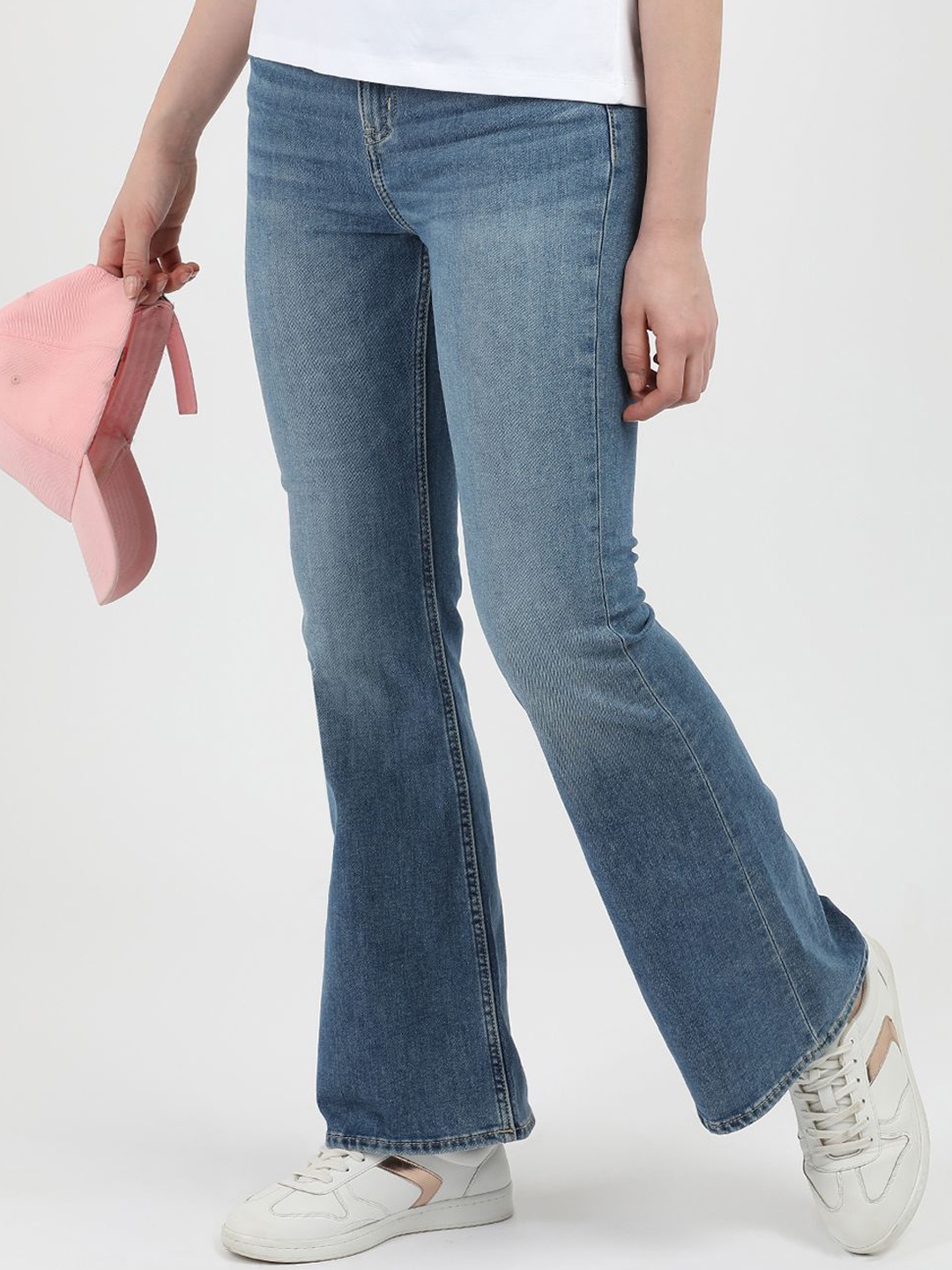 

Calvin Klein Jeans Women Solid Flared Mildly Distressed Light Fade Jeans, Blue