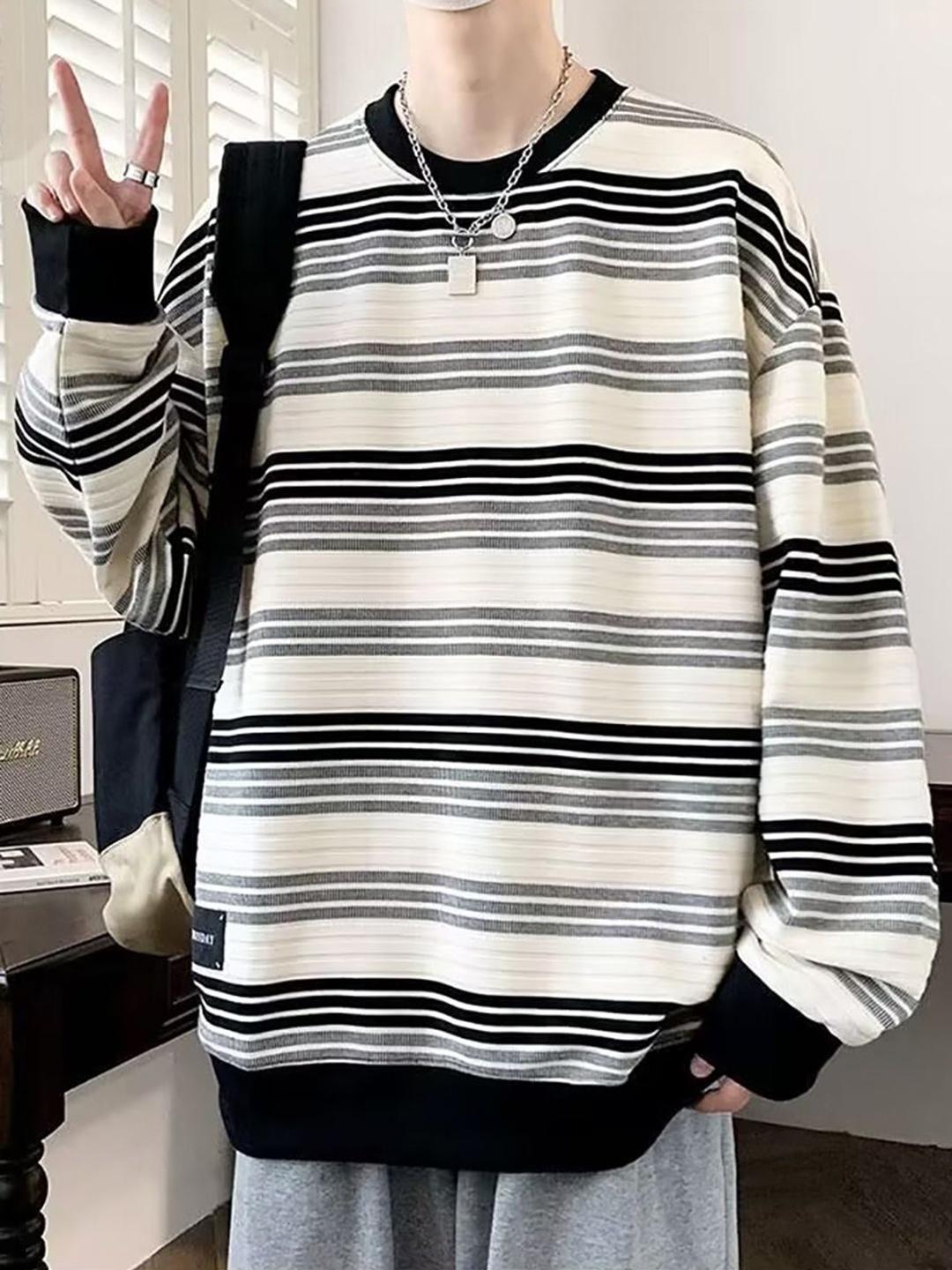 

StyleCast x Revolte Men Striped Round Neck Pullover Sweatshirt, Black