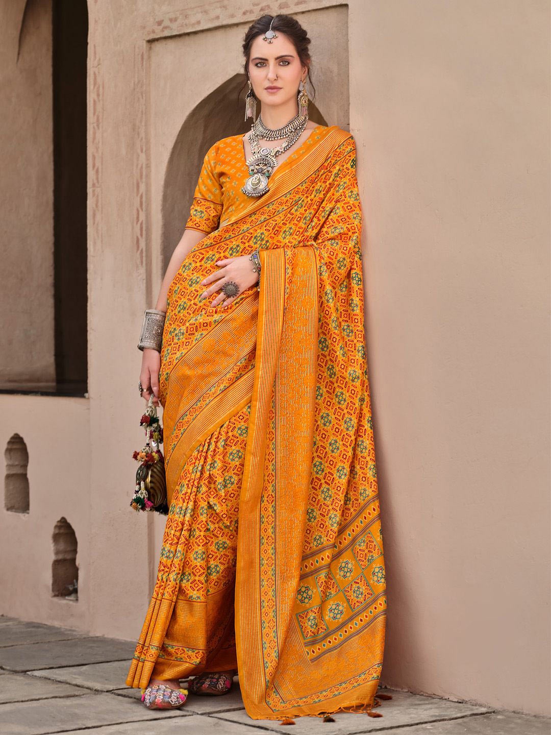 

Anouk Ethnic Motifs Zari Mustard Silk Blend Banarasi Saree with Matching Blouse