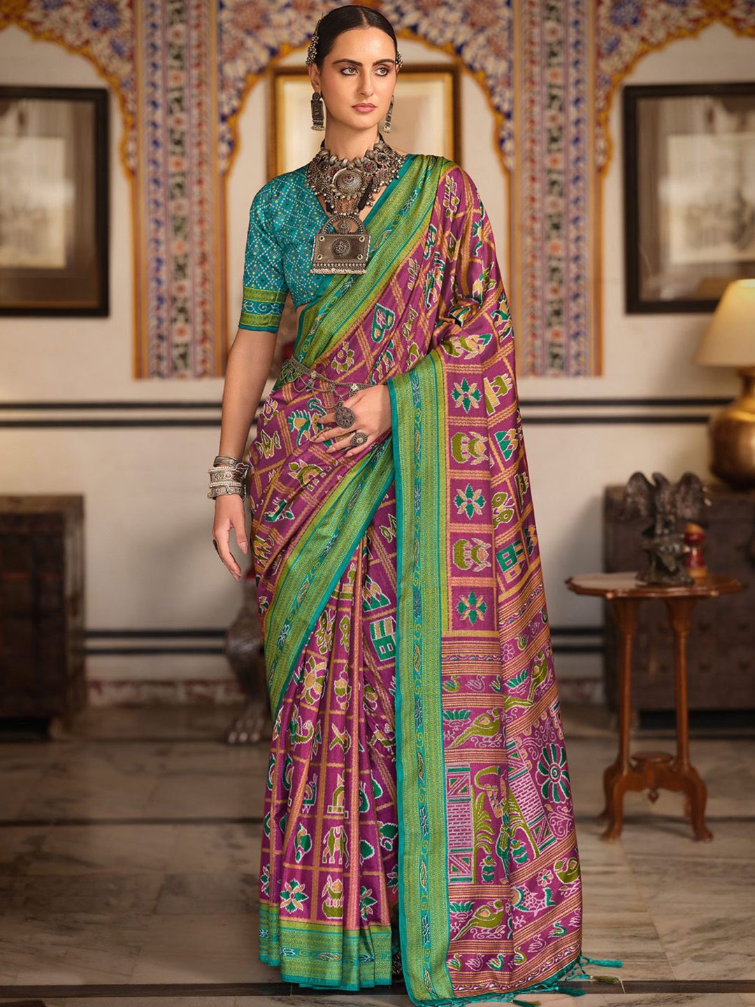 

Anouk Ethnic Motifs Printed Zari Patola Celebrity Saree, Magenta