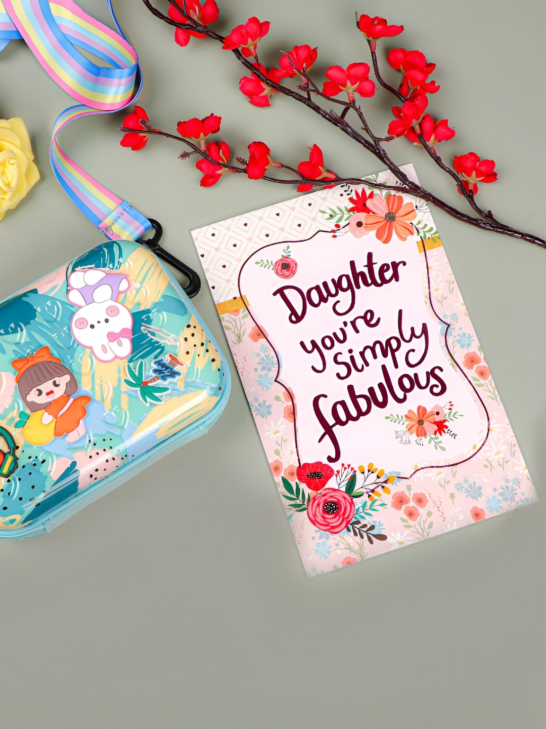 

Archies Printed Sling Bag With Happy Daughters Day Greeting Card, Blue
