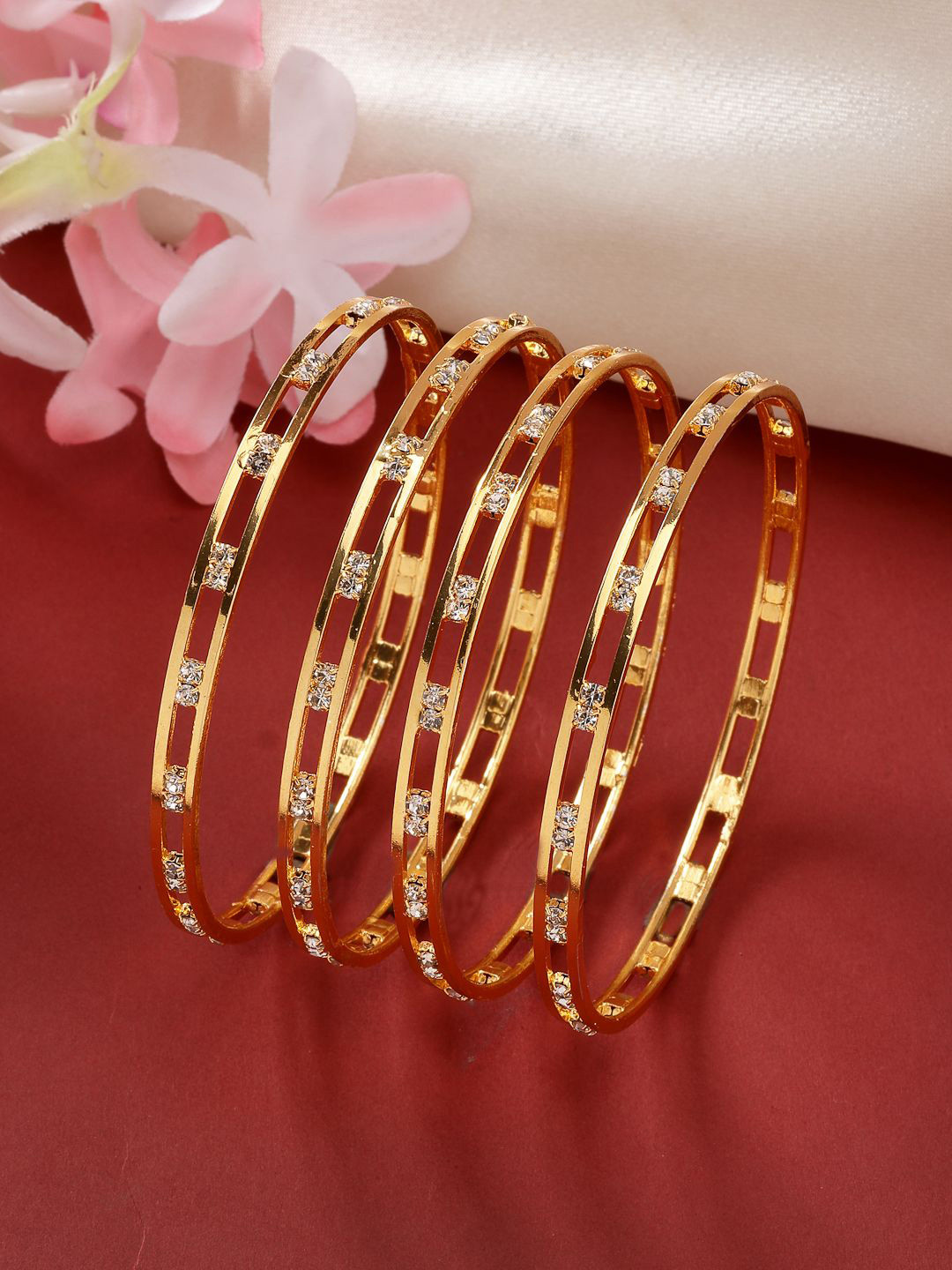 

NVR Set Of 4 Gold Plated Cubic Zirconia Stone Studded Bangles