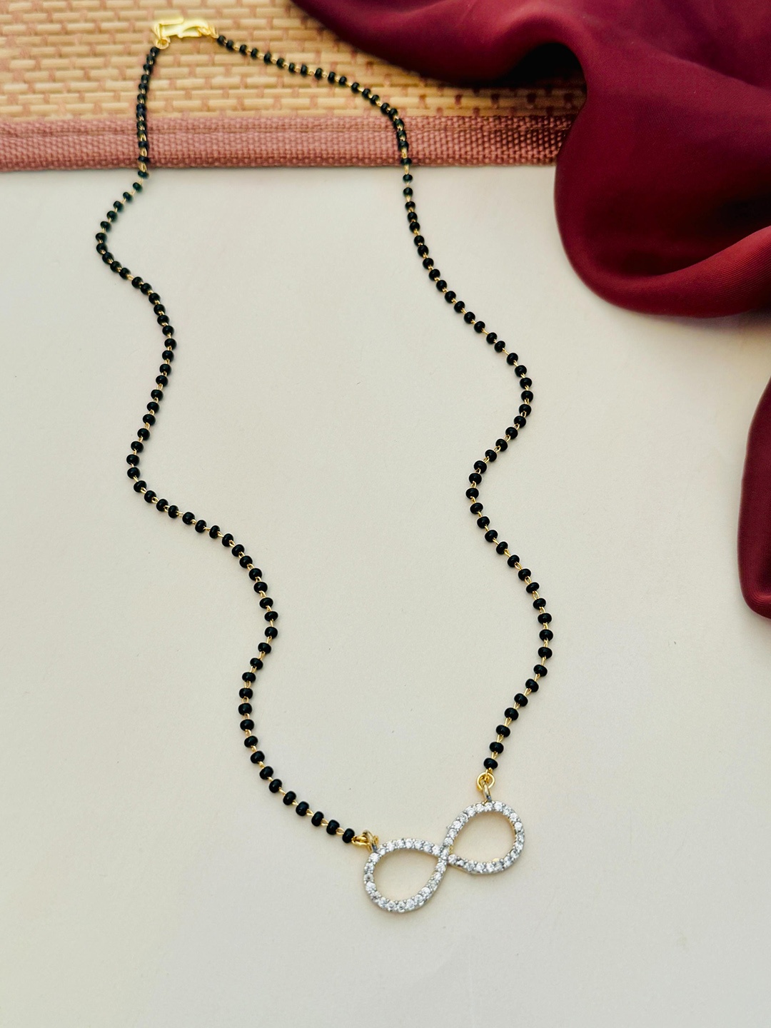 

Anouk Gold-Plated Artificial Stones and Beads Mangalsutra