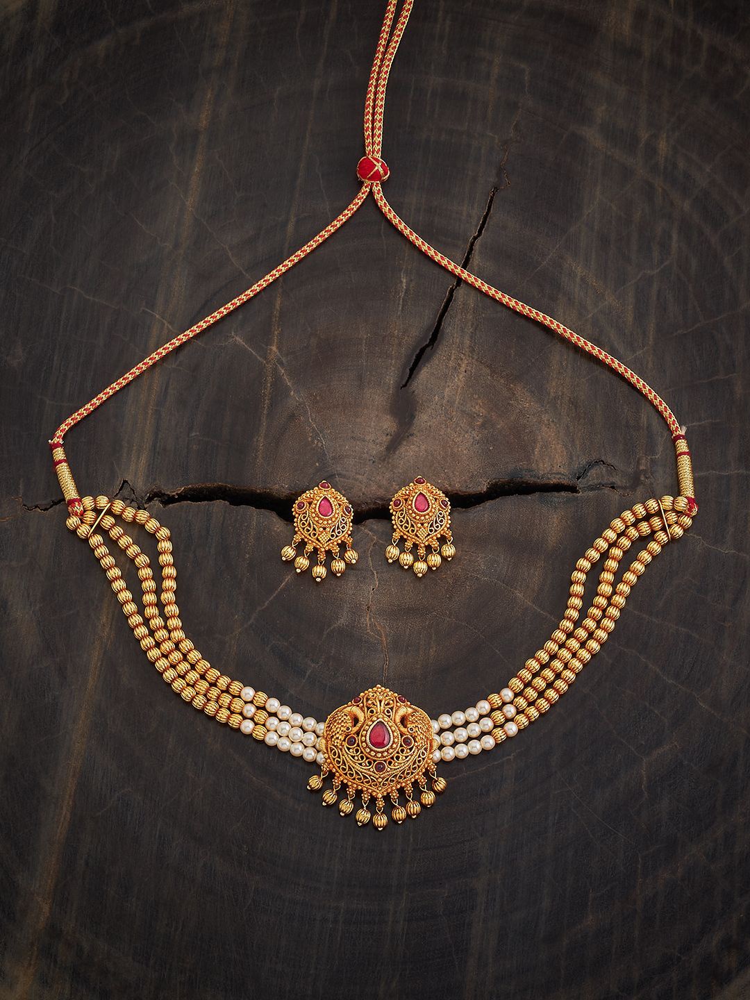 

Kushal's Fashion Jewellery Ruby Gold-Plated Stone Studded Antique Jewellery Set