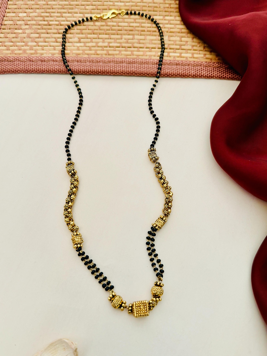 

Anouk Gold-Plated Artificial Stones and Beads Mangalsutra
