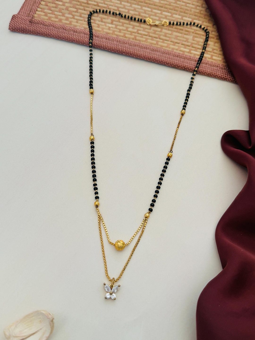 

Anouk Gold-Plated Artificial Stones and Beads Mangalsutra