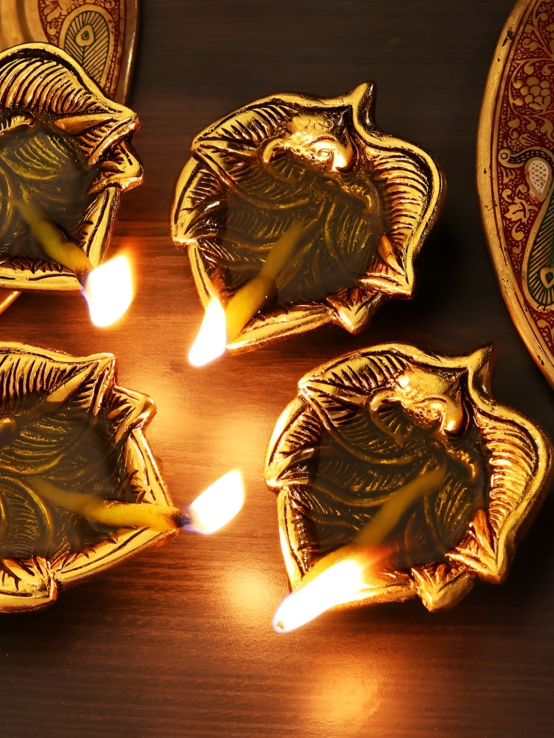 

Indianshelf 4 Pieces Diwali Diya Aluminium Gold Finish Oil Lamp Ganpati on Leaf Diva