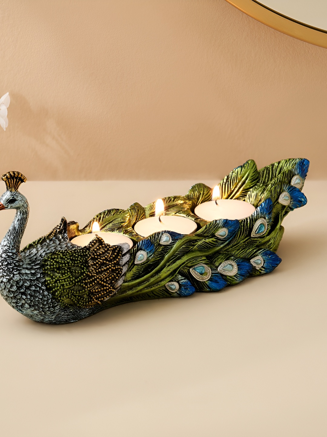 

Home Centre Green & Blue Embellished Mayur Candle Holder