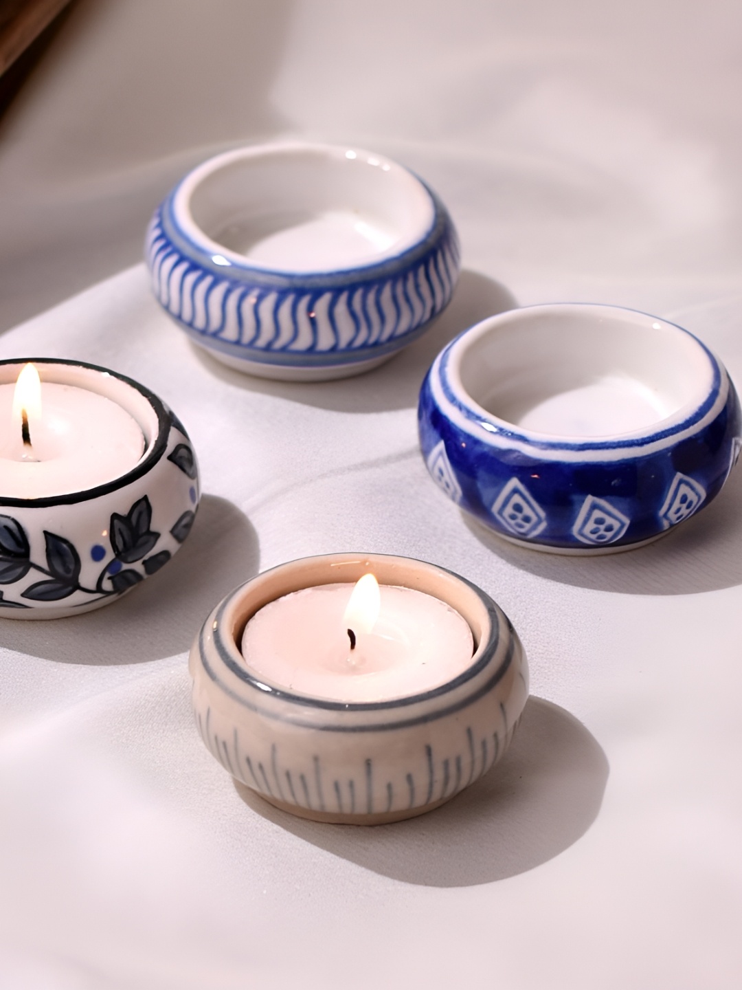 

Indianshelf Blue & Cream-Coloured 4 Pieces Ceramic Candle Holder