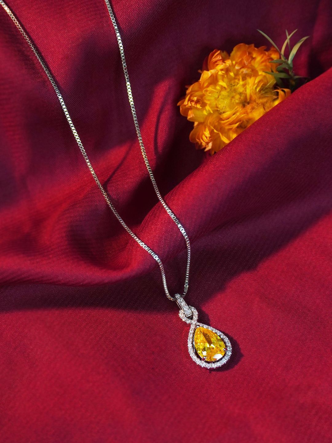

Niscka Silver-Plated Cubic Zirconia Studded Teardrop Shaped Pendant with Chain